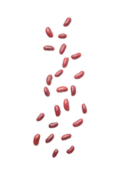 Red beans falling isolated on the white background.