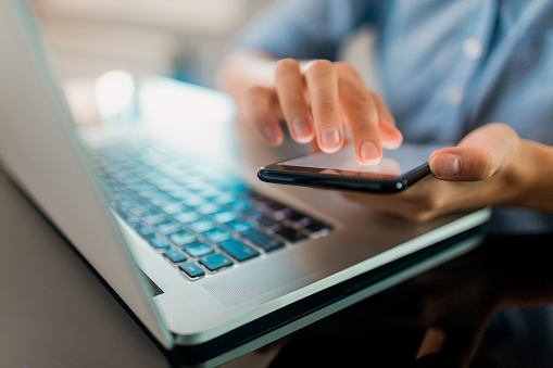 Close up of a business woman using a phone