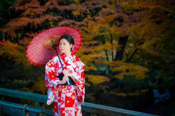 istock The Kimono Girl With Red Umbrella 1025144964