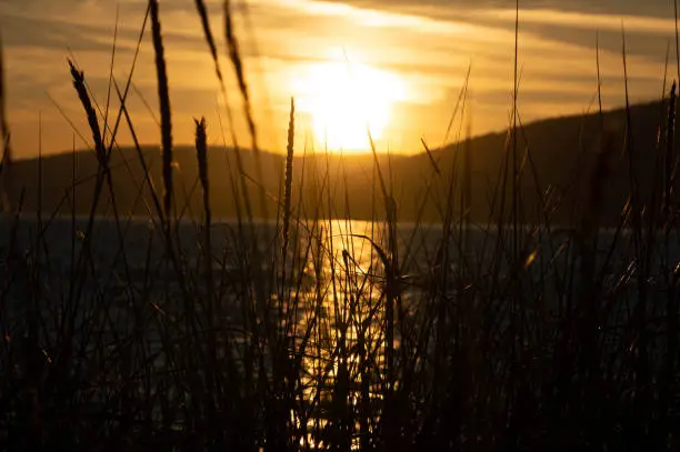 Anacortes, WA in Skagit County. Facing Guemes Island at sunset in the summertime.