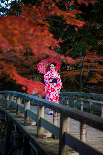 istock The Kimono Girl With Red Umbrella 1025145482