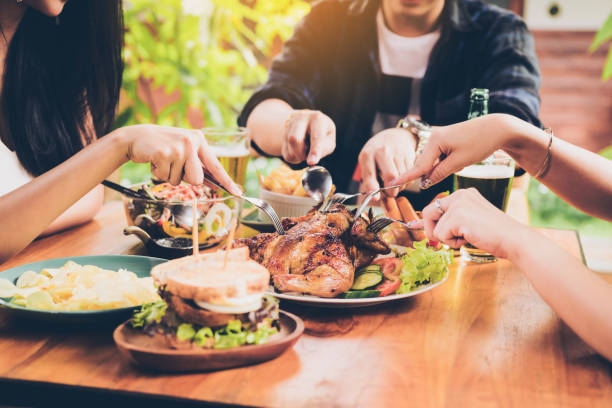 istock Asian friends enjoying eating turkey at restaurant. 1025149640
