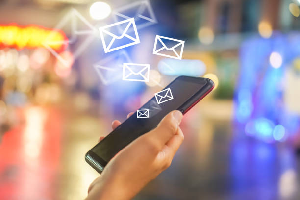 istock Woman hand using smartphone to send and recieve email. 1025157858