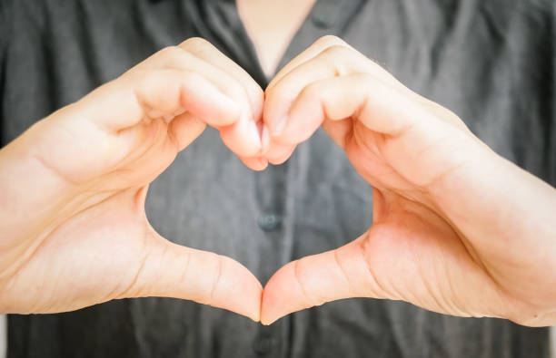 istock Woman hand doing Heart shape. 1025157904
