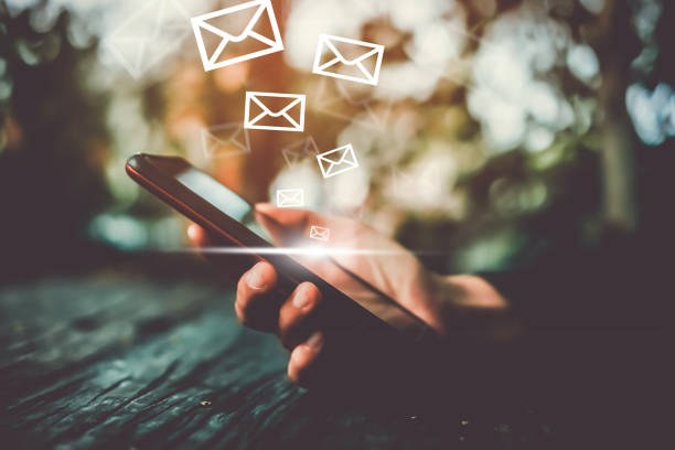 istock Woman hand using smartphone to send and recieve email. 1025158034