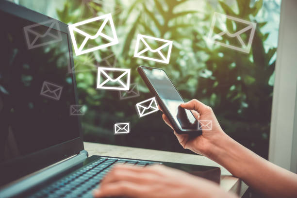 istock Woman hand using smartphone to send and recieve email. 1025158558