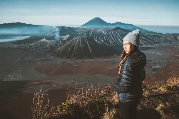Traveler women and sunrise at volcano Mt.Bromo (Gunung Bromo) Kingkong hill East Java,Indonesia