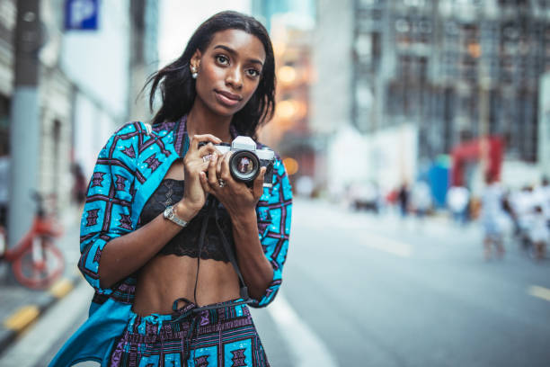 istock Black lady photographer 1025176212