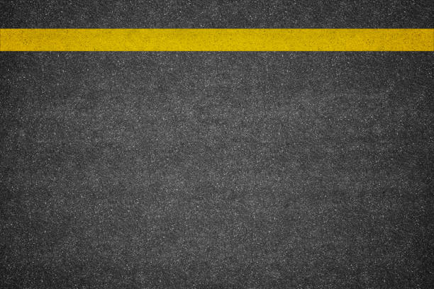 istock Asphalt road background with yellow line 1025179658