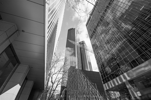 Black and white low angle view of modern corporate buildings skyscrapers, CBD Sydney Australia, background with copy space, full frame horizontal composition