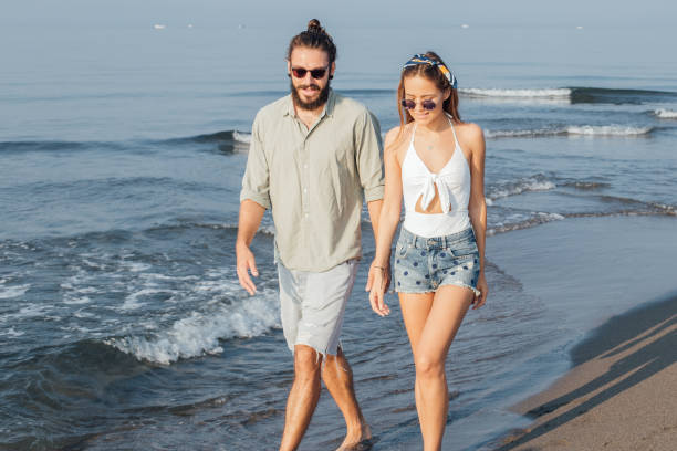 istock Romantic young couple at the beach 1025204356