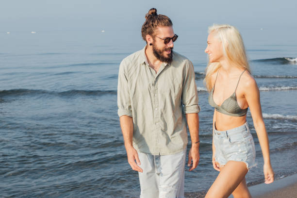 istock Young couple at the sunny beach 1025204726
