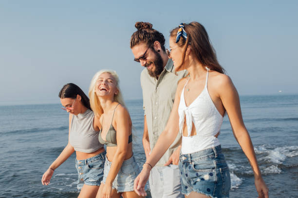 istock A group of pretty young people having fun at the beach 1025207572