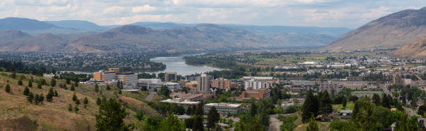 Kamloops, BC Aerial panoramic view of Kamloops City during a cloudy summer day. Located in Interior BC, Canada. kamloops stock pictures, royalty-free photos & images
