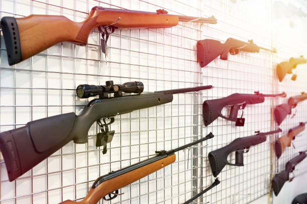 istock Air guns on stand in shop 1025213850