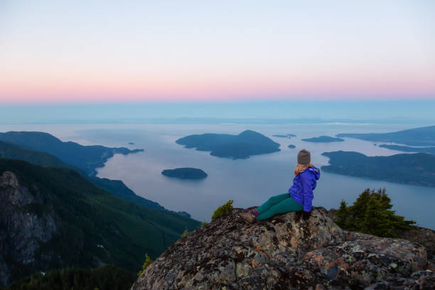 istock Girl on top of Mountain 1025213882
