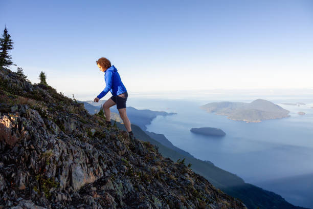 istock Girl hiking up a mountain 1025213900