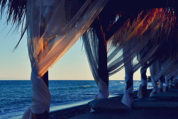 istock Santorini Beach Tanning Beds With Sunset Background 1025221928