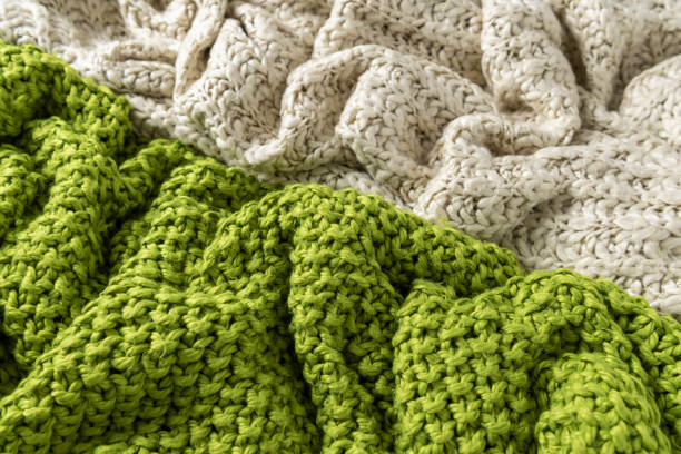 istock Close-up of knitted wool blankets on white background. 1025226686