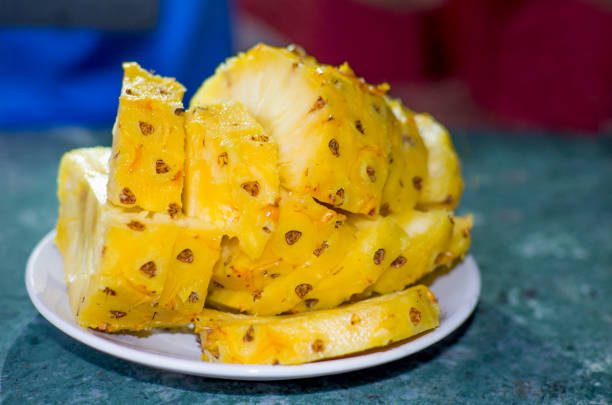 ripe yellow pineapple pieces on a plate