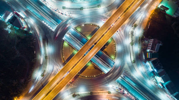 istock Circle of highway road intersection at dusk for transportation, distribution or traffic background. 1025244268