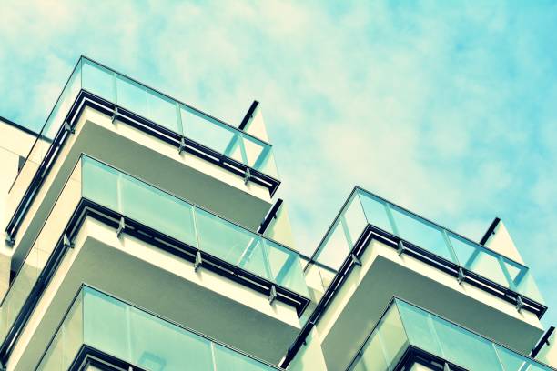 istock Modern apartment building exterior. Retro colors stylization 1025259720