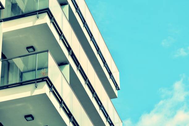 istock Modern apartment building exterior. Retro colors stylization 1025260074