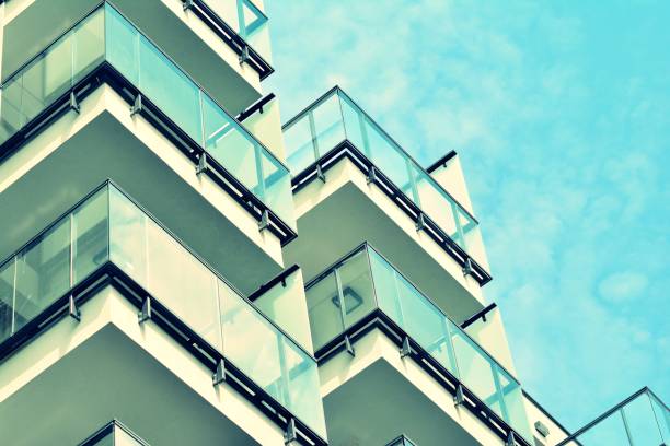 istock Modern apartment building exterior. Retro colors stylization 1025260266
