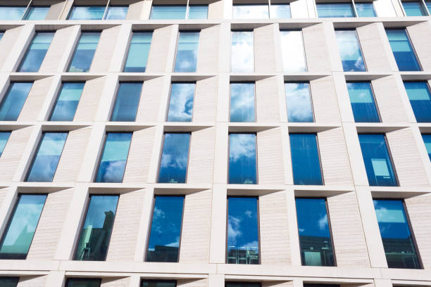 istock Facade of a modern style office building with multiple big glass windows 1025265074