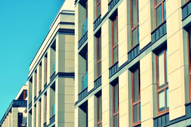 istock Modern apartment building exterior. Retro colors stylization 1025267958