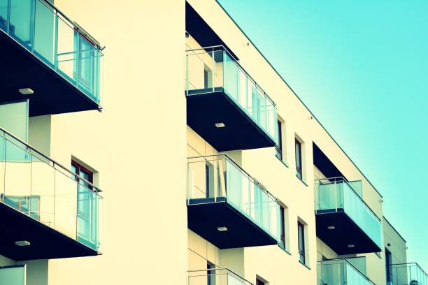 istock Modern apartment building exterior. Retro colors stylization 1025268058