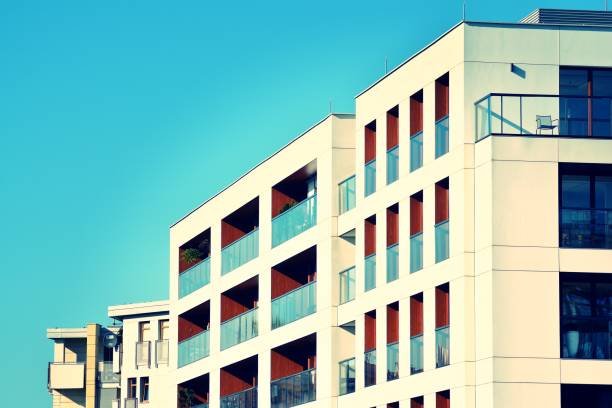 istock Modern apartment building exterior. Retro colors stylization 1025268092