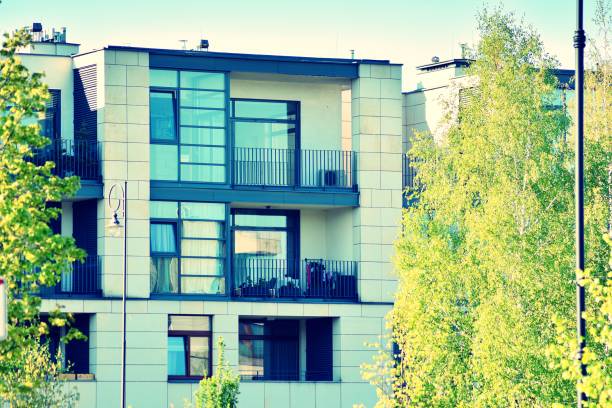 istock Modern apartment building exterior. Retro colors stylization 1025270950