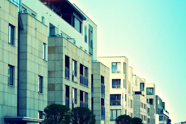 istock Modern apartment building exterior. Retro colors stylization 1025271628