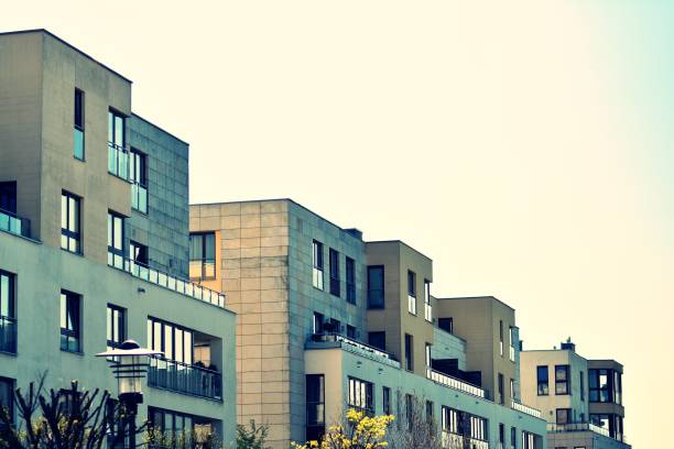 istock Modern apartment building exterior. Retro colors stylization 1025272014