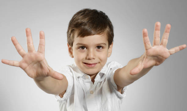 Cute boy Cute boy making a hand gesture 10 11 years photos stock pictures, royalty-free photos & images