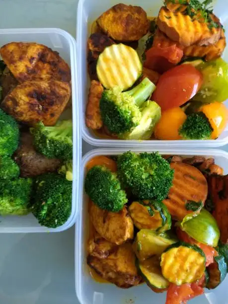 fresh food containers with mixed vegetables and lean meat as an example of pre-cooking by athletes and bodybuilders