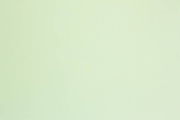 istock pastel green color cement wall texture for background. 1025294486