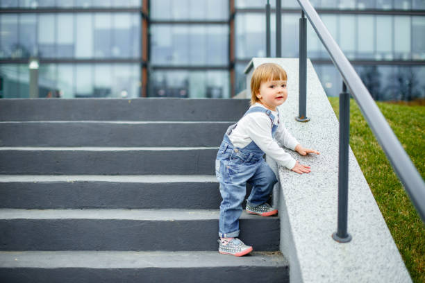 istock Small child learns to go down the stairs 1025306732