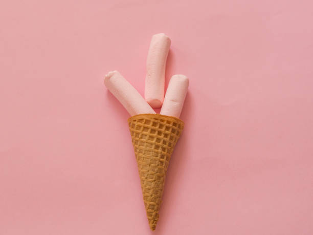 istock Marshmallow in ice cream cone on pink 1025306844
