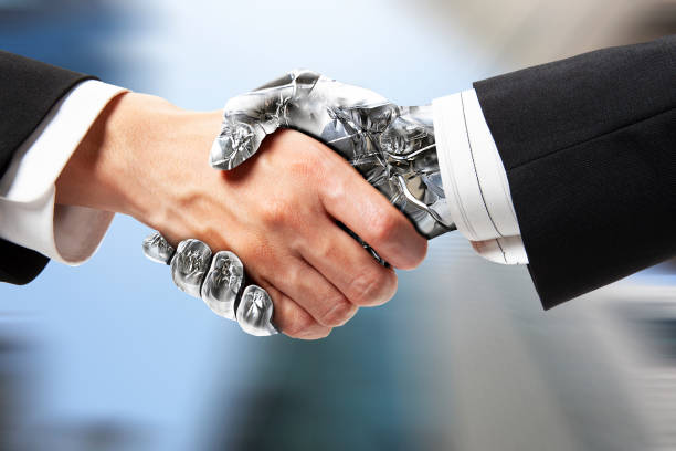 Robot handshake stock photo