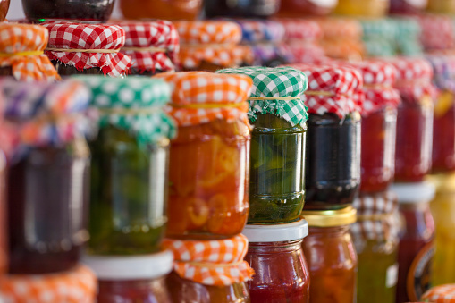 Glass jars of homemade jam and marmalade for sale