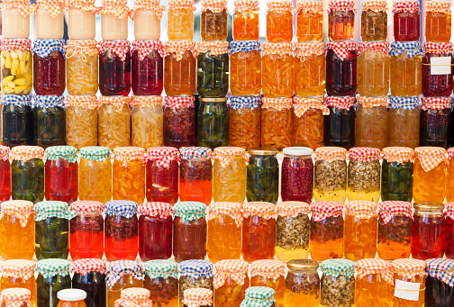 Glass jars of homemade jam and marmalade for sale