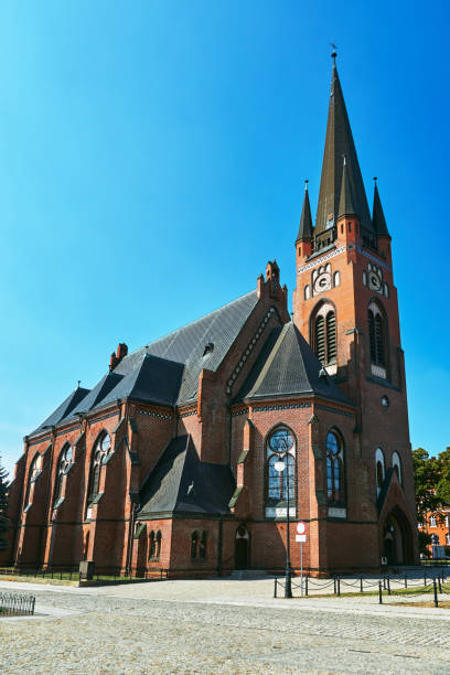 istock Neo-Gothic, historic church with a clock tower 1025331672
