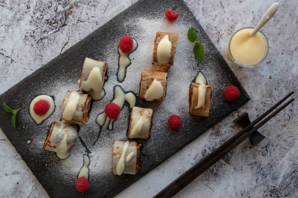 istock banan pancake sushi dessert with dip and chocolate syrup 1025332154