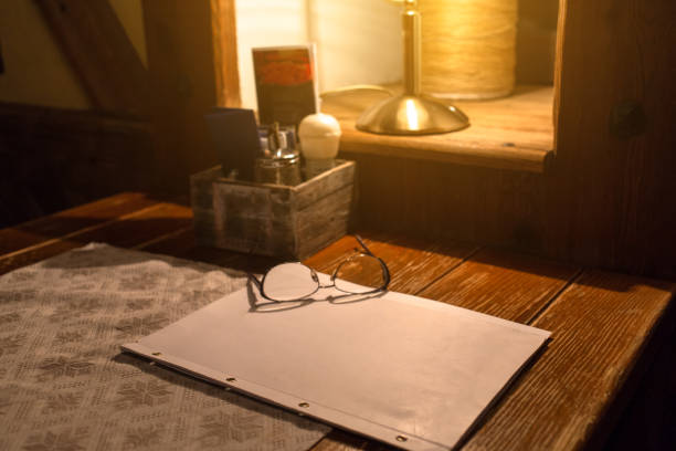 istock empty white paper with eyeglasses on the brown wooden table 1025338888