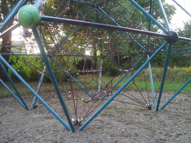 istock Close up kids playground metallic structure and ropes for climbing 1025359486