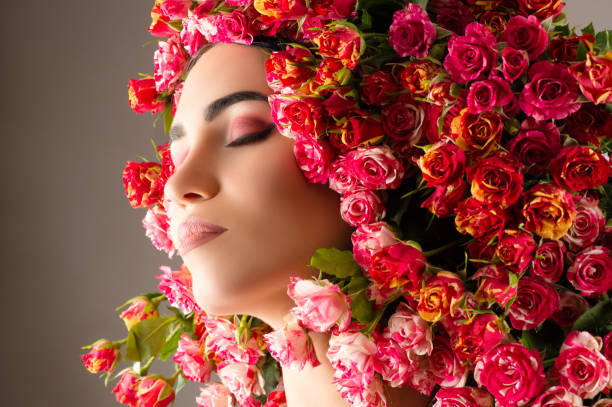 istock beautiful makeup profile face with roses closeup 1025362438