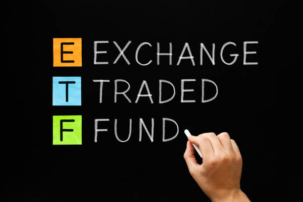ETF - Exchange Traded Fund Concept Hand writing ETF - Exchange Traded Fund with white chalk on blackboard. exchange traded fund stock pictures, royalty-free photos & images