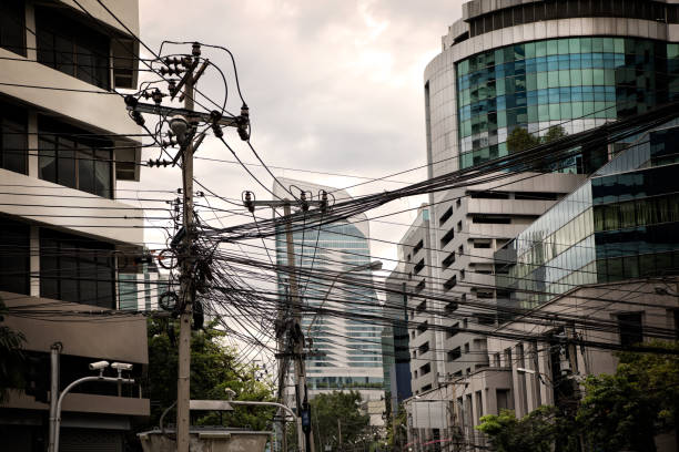 istock Close up electricity power line and building exterior 1025372854